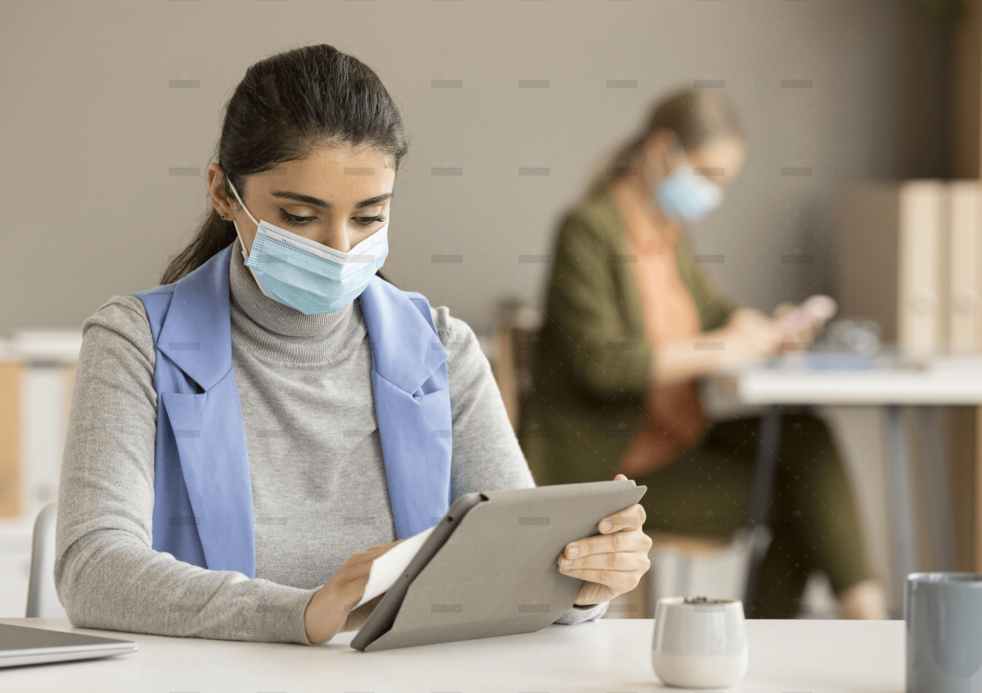 demo-attachment-192-employee-disinfecting-electronic-device
